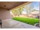 Large backyard with grassy area and covered patio at 44562 W Sedona Trl, Maricopa, AZ 85139