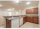 Basement kitchen with wood cabinets and dishwasher at 44562 W Sedona Trl, Maricopa, AZ 85139