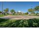 Outdoor basketball court in a residential community at 44562 W Sedona Trl, Maricopa, AZ 85139