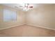 Spacious bedroom with ceiling fan and window blinds at 44562 W Sedona Trl, Maricopa, AZ 85139