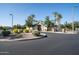 Community entrance with gated access and landscaping at 44562 W Sedona Trl, Maricopa, AZ 85139