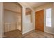 Bright entryway with tiled floor, wooden door and stairs at 44562 W Sedona Trl, Maricopa, AZ 85139