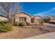 House exterior with landscaping and a long driveway at 44562 W Sedona Trl, Maricopa, AZ 85139