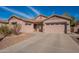 Two-story home with a large driveway and landscaping at 44562 W Sedona Trl, Maricopa, AZ 85139