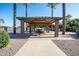 Relaxing covered picnic area with tables and benches at 44562 W Sedona Trl, Maricopa, AZ 85139