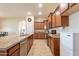 Modern kitchen with granite countertops and stainless steel appliances at 44562 W Sedona Trl, Maricopa, AZ 85139