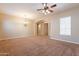 Spacious living room featuring vaulted ceilings and a cozy seating area at 44562 W Sedona Trl, Maricopa, AZ 85139