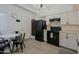 Modern kitchen with black appliances and a breakfast nook at 4754 N 14Th St, Phoenix, AZ 85014