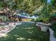 Landscaped backyard with large tree and grassy area at 5040 N Arcadia Dr, Phoenix, AZ 85018