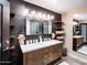 Spa-like bathroom with double sinks and dark tile at 5040 N Arcadia Dr, Phoenix, AZ 85018