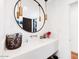 Modern powder room with a large round mirror at 5040 N Arcadia Dr, Phoenix, AZ 85018