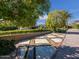 Private gated entrance with stone driveway and landscaping at 5040 N Arcadia Dr, Phoenix, AZ 85018