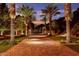 Grand entry with palm trees and brick pavers at 5040 N Arcadia Dr, Phoenix, AZ 85018