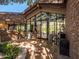 Stone and glass exterior entryway to the home at 5040 N Arcadia Dr, Phoenix, AZ 85018