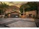 Modern garage with stone facade and large glass door at 5040 N Arcadia Dr, Phoenix, AZ 85018