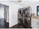 Laundry room with modern appliances and white cabinets at 5040 N Arcadia Dr, Phoenix, AZ 85018