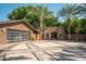 Elegant motor court with stone pavers and landscaping at 5040 N Arcadia Dr, Phoenix, AZ 85018