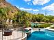 Luxury pool and spa with a view of the backyard and mountains at 5040 N Arcadia Dr, Phoenix, AZ 85018