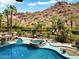 Resort-style pool and spa with mountain backdrop at 5040 N Arcadia Dr, Phoenix, AZ 85018