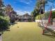 Landscaped backyard putting green with net and house view at 5040 N Arcadia Dr, Phoenix, AZ 85018