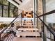 Modern staircase with metal railing and light wood steps at 5040 N Arcadia Dr, Phoenix, AZ 85018