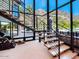 Contemporary floating staircase with glass and metal accents at 5040 N Arcadia Dr, Phoenix, AZ 85018