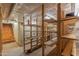 Unfinished basement with ample storage shelving and stairs at 522 W Roosevelt St, Phoenix, AZ 85003