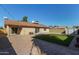 Nice backyard with patio, artificial grass, and storage shed at 6207 W Acoma Dr, Glendale, AZ 85306