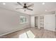 Bedroom with double closets and window, laminate floor at 6207 W Acoma Dr, Glendale, AZ 85306