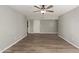 Bright living room featuring gray walls and wood-look flooring at 6207 W Acoma Dr, Glendale, AZ 85306