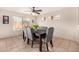 Dining room with dark wood table and gray chairs at 6538 W Nez Perce St, Phoenix, AZ 85043