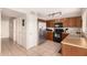 Kitchen with wood cabinets, stainless steel appliances at 6538 W Nez Perce St, Phoenix, AZ 85043