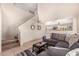 Living room with staircase, gray couch, and coffee table at 6538 W Nez Perce St, Phoenix, AZ 85043