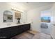 Double vanity bathroom with a view of a bedroom at 7687 E Wing Shadow Rd, Scottsdale, AZ 85255