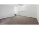 Bright bedroom with neutral carpet, window with shutters, and staircase access at 7687 E Wing Shadow Rd, Scottsdale, AZ 85255