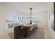 Elegant dining room with chandelier, hardwood floors, and views to living room at 7687 E Wing Shadow Rd, Scottsdale, AZ 85255