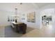 Elegant dining room features a large wooden table, chandelier, and modern art at 7687 E Wing Shadow Rd, Scottsdale, AZ 85255