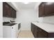 Bright laundry room with washer, dryer, and ample storage at 7687 E Wing Shadow Rd, Scottsdale, AZ 85255