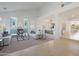 Open concept living room with high ceilings and glass block fireplace at 7687 E Wing Shadow Rd, Scottsdale, AZ 85255