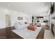 Open living area with hardwood floors and a view into the kitchen at 7687 E Wing Shadow Rd, Scottsdale, AZ 85255