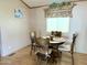 Small dining area with round wood table and four chairs at 7750 E Broadway Rd # 232, Mesa, AZ 85208