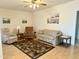 Living room features hardwood floors, comfy seating, and southwestern decor at 7750 E Broadway Rd # 232, Mesa, AZ 85208