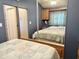 Main bedroom with a queen-size bed and mirrored closet doors at 7750 E Broadway Rd # 232, Mesa, AZ 85208