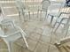 Covered patio with white plastic chairs and a small table at 7750 E Broadway Rd # 232, Mesa, AZ 85208