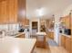 Galley kitchen with white appliances and wood cabinets at 8600 E Broadway Rd # 91, Mesa, AZ 85207