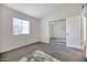 Bright bedroom with mirrored closet doors and neutral carpeting at 8901 W Loma Ln, Peoria, AZ 85345