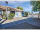 Condo entrance with walkway and well-maintained landscaping at 8901 W Loma Ln, Peoria, AZ 85345