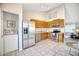 Kitchen features stainless steel appliances and a laundry area at 8901 W Loma Ln, Peoria, AZ 85345