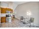 Kitchen with stainless steel appliances and breakfast nook at 8901 W Loma Ln, Peoria, AZ 85345