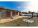 Backyard patio, grass, and bird bath at 910 S Portland Cir, Mesa, AZ 85206